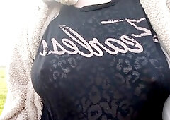 Busty babe flaunts her boobs in sheer top in public attraction