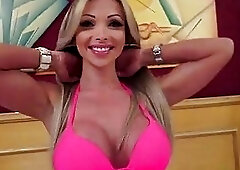 Gorgeous tranny Carla Novaes shows her amazing tits while stroking