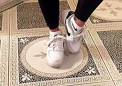 Valeria comes in after her intense workout and sits down on the daybed. Her white sneakers are visibly indecent. That babe places her feet on the tabl