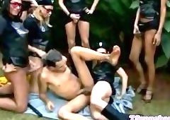 Shemale babes tagteam him outdoors