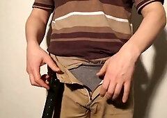 Close up of man undressing and pleasuring his uncut cock until fully erect