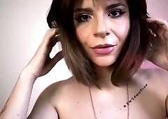 Big tittied MILF mistress poses and plays with herself