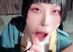 Asian bimbo sucks on a big cock close up