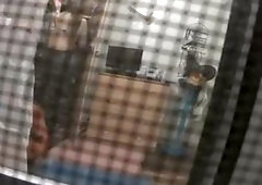 Spy camera catches neighbor in her bedroom undressing