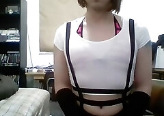 Crossdressing amateur shemale in skirt and fishnet stockings jerks off