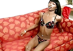 Slim black tranny Kima dildos her ass and masturbates solo