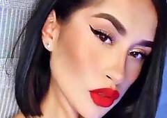 Adorable brunette with big red lips and short hairs poses on cam