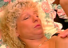 Busty blond mature gets her pussy fisted