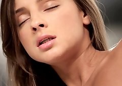 A brunette slowly removes her panties and then she moans loudly