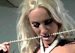 An impressive blond suggests her intimacy to a man who understands her wants.