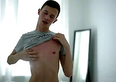 Platinum-blonde twunk Aaron A strokes to a cumshot on his sofa