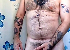 Hairy daddy peels off his white boxers and strokes himself before hopping into the shower.