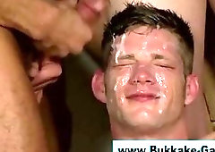 Interracial bukkake orgy soaks twink