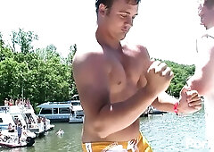 Dark-haired beauty shares steamy kisses before being taken from behind at the floating dock