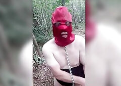 Fabienne shows off in the woods in a bitch and a nylon balaclava