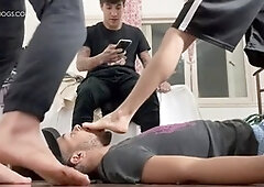 Brazilian foot slave serves a group of guys