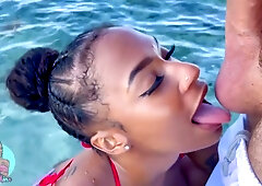 Sarai Minx gets intimate with a white diver during a tropical snorkeling trip