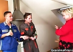 Two repairmen bang busty grandma from both ends