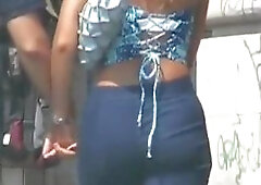 Hot asses in denim wiggling around the street candid video