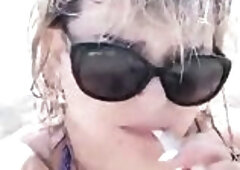 Smokin' fetish. big beautiful woman large melons on public beach