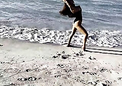 Hot Monika Fox in Ebony Bodysuit on Beach