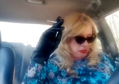 Mature blonde GILF enjoys her long cigarette while cruising in her car
