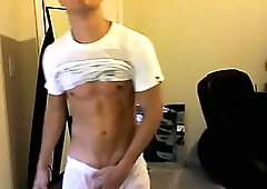 Hunk stripping & jizzing in condom