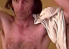 Older gay guy with a hairy chest brings hiis boner to a messy end