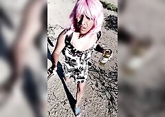 Delightful transsexual in mini costume and sandals walking in very hawt public