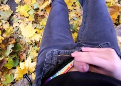 Femboy draining off outside in the fall leaves