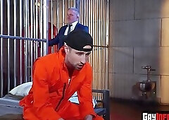 The old man gives a hard blowjob to the stud prisoner