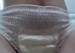 Horny teen wets overflowing diaper
