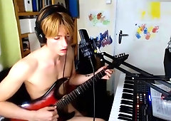 handsome dude plays music after masturbates and cums