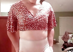 Tranny LisaB. takes her clothes off slowly.