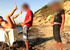Brunette MILF is having much fun on the beach with 3 men during her vacation