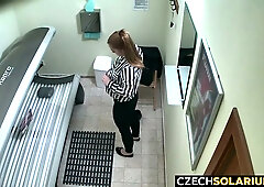 Redhead caught on hidden cam playing with herself in tanning bed