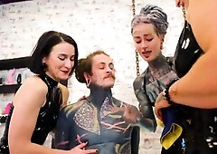 Femdom vixens punishing slave's cock in BDSM group session