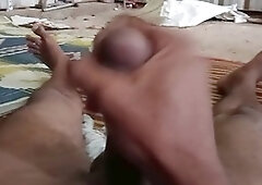 Handsome Indian twink gives a handjob to a hung black guy outdoors