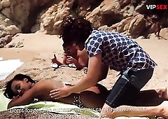 Topless Black Gal Gets Her Butt Stroked by 2 Chaps on the Sand
