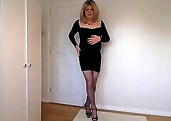 Putting on my panties and fishnets with my little black dress