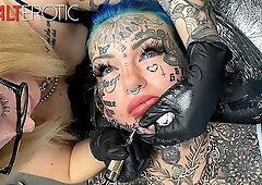 Australian bombshell Amber Luke shows off her fresh chin tattoo