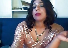 Classy crossdressing shemale teases while smoking and taking a selfie