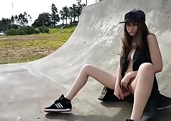 Naughty amateur teen plays with her tight cunt in the park