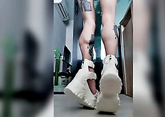 Tattooed dominatrix legs with flawless brawny calves