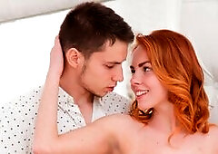 Redhead babe Candy Red walks into the room while her boyfriend is writing his novel and brings him some fruit. She looks a vision in a pink minidress 