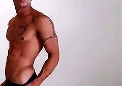 Ripped young man's black mask wearing masturbation