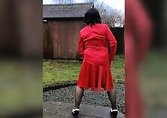 Sexy tv crossdresser Nottstvslut outdoors in hot red satin suit nylons and heels.