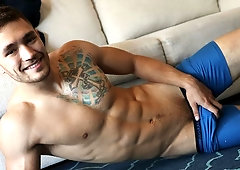 Tatted-up brunette guy Ricky Owen jerking his dick