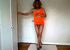 Orange minidress nude pantyhose and high heels