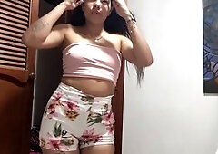 Seductive lady teases in lingerie and shows off her boobs.